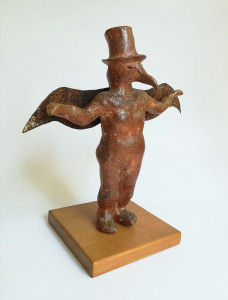 wood-fired ceramic sculpture by Katja Abbott of a bird in a top hat