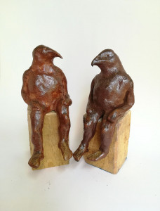 wood-fired ceramic sculpture by Katja Abbott of 2 therianthropic birds in conversation