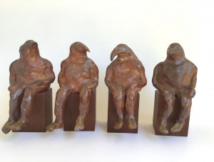 Wood-fired ceramic sculpture by Katja Abbott of 4 birdmen - bird therianthanthropes - in conversation