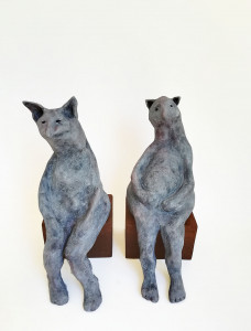 ceramic sculpture by Katja Abbott of 2 therianthropic cats in conversation