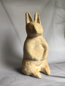 wood-fired ceramic sculpture by Katja Abbott of a rabbit