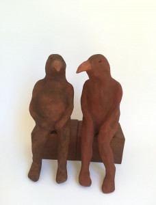 ceramic sculpture by Katja Abbott of two seated therianthrope birds in conversation